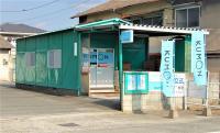 旭教室の外観です。緑色の建物です。